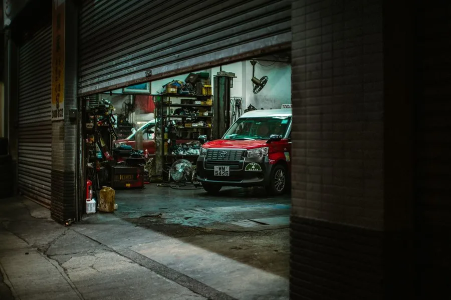 The shop building with the roll-up bay doors open