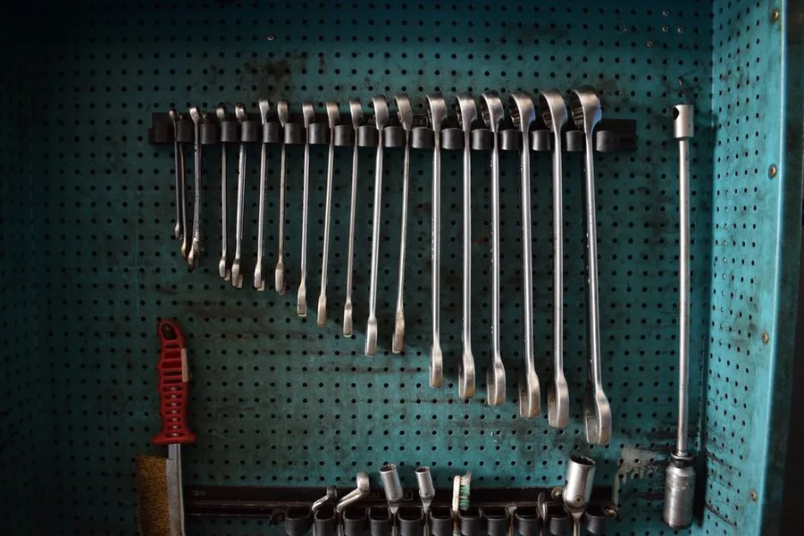 Wrenches and tools arranged on the shop wall