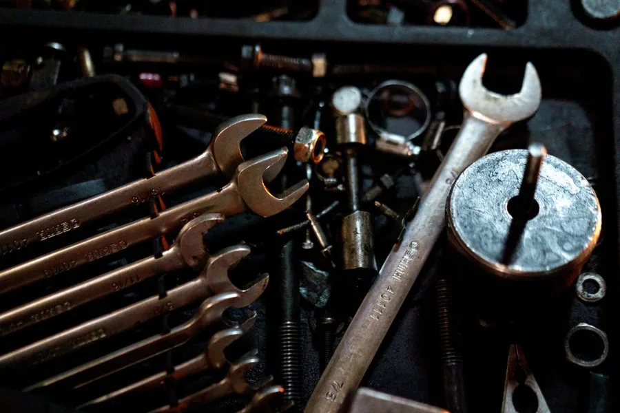 A row of wrenches and tools in the chest