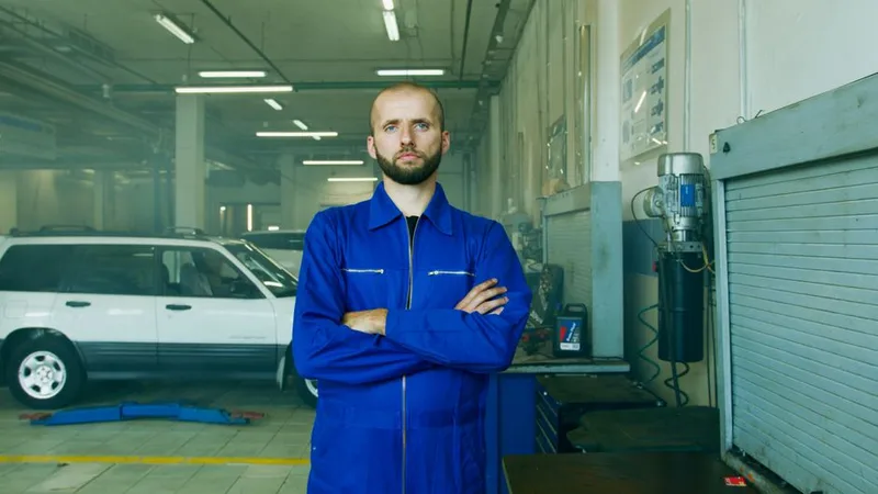 Nils Bergstrom, owner and lead technician, standing in the shop bay
